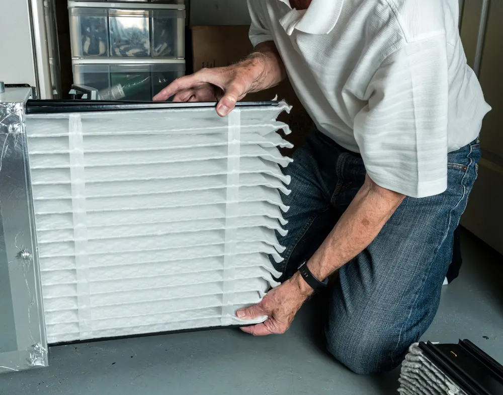 charles stone hvac technician replacing air filter in nashville home