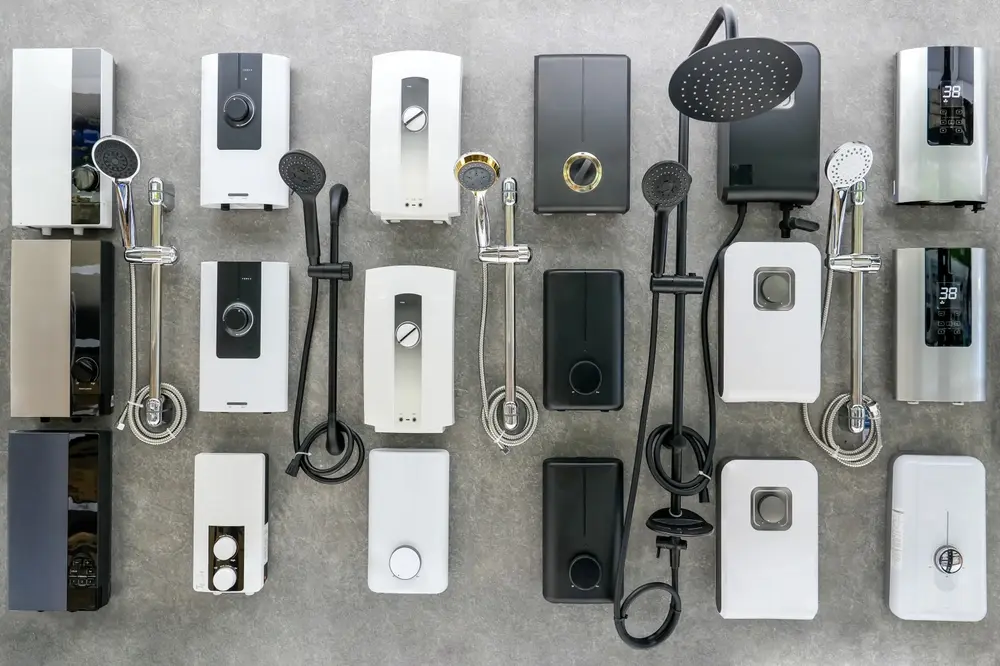 Tankless Water Heater vs. Tank: Which is Right for You? - Charles Stone – Heating and Cooling Variety of modern electric instantaneous water heater on a stand with taps and showers