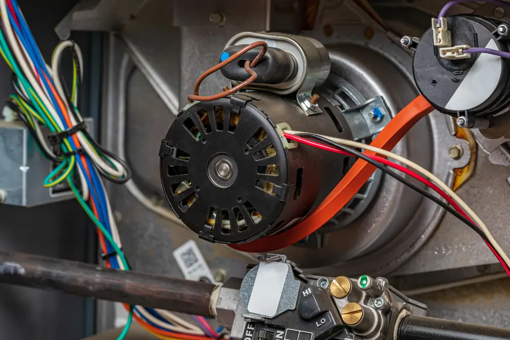 Furnace Not Turning On? Here's Why - Charles Stone – Heating and Cooling Closeup of heater exhaust fan inside of furnace. Concept of HVAC maintenance, repair, service and installation
