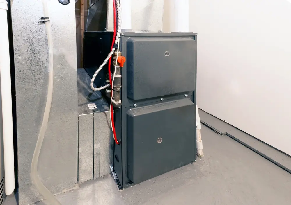 Furnace Not Turning On? Here's Why - Charles Stone – Heating and Cooling A home high energy efficient furnace in a basement