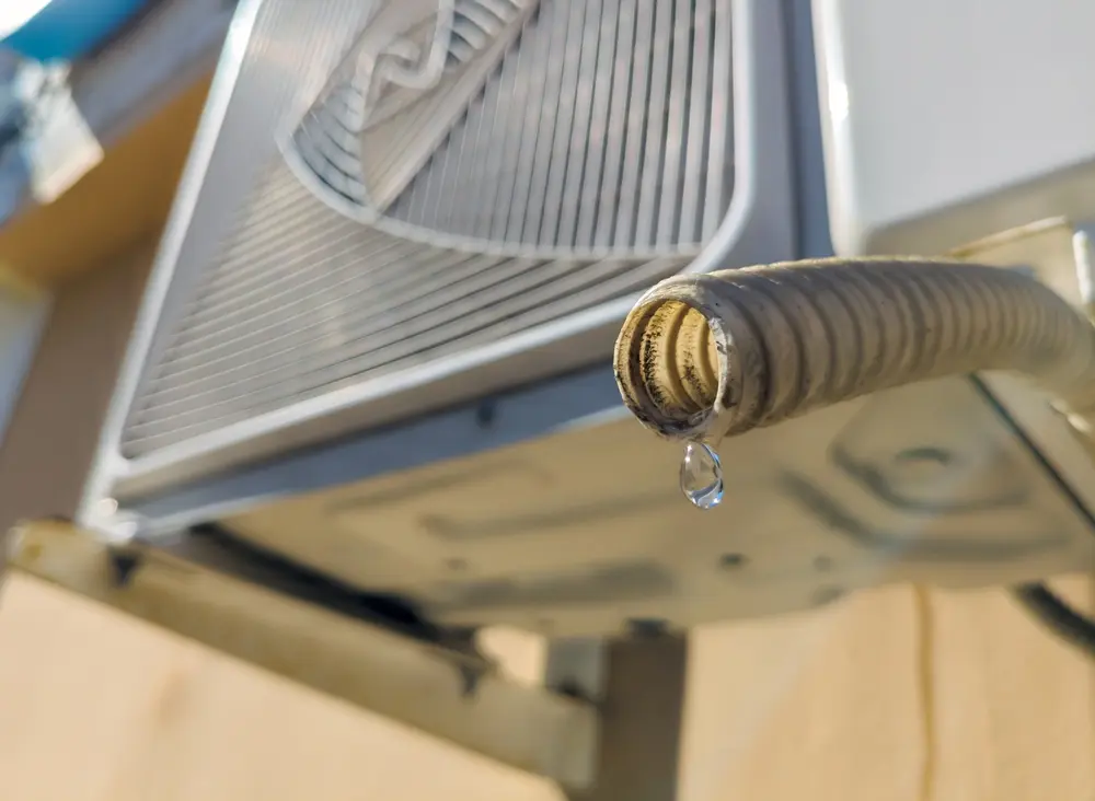 Water dripping from the drain pipe of the outdoor unit of the air conditioner